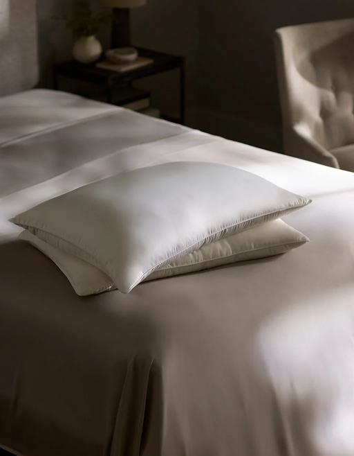 Cozy Earth Silk pillow with gel fiber fill offering soft comfort for back sleepers