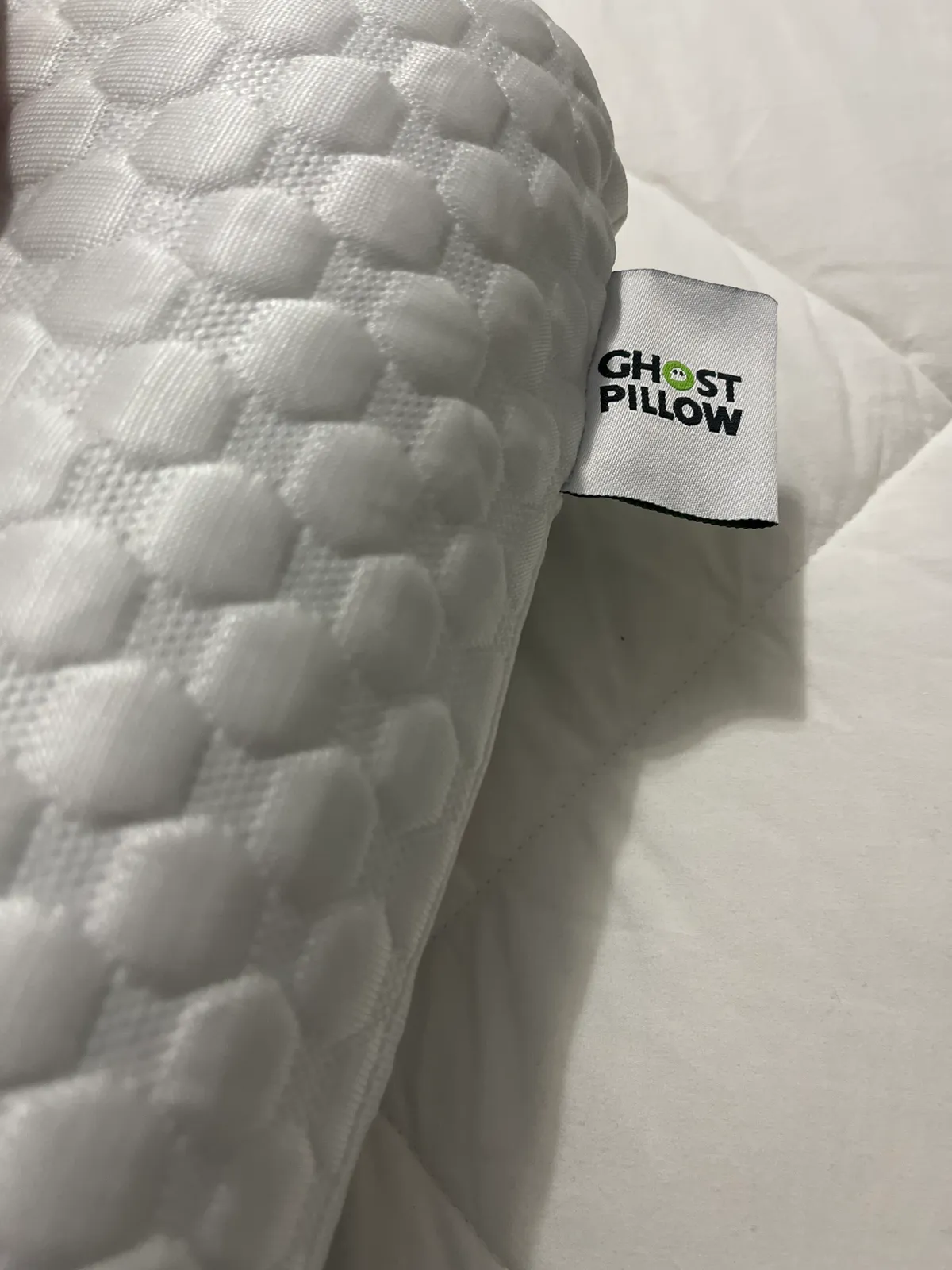 Leesa Hybrid Pillow with reversible down-like and gel sides, designed for year-round use and dual cooling comfort.