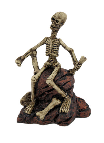 Creepy Skeleton Sitting On Rocks Statue Figure Main image