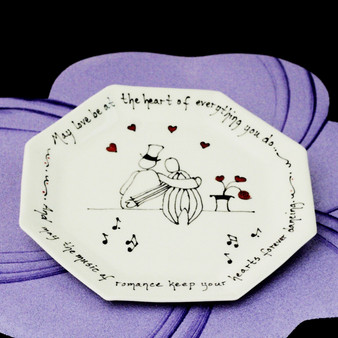 May love be at the heart of everything you do ~ And may the music of romance keep your hearts forever dancing. </br> Two men sitting on a bench from behind, with small hearts and music notes hand painted.