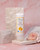 Natural Apricot Shells Exfoliating Face Scrub with Apricot Seed Powder, Fuller's Earth Clay, Shea Butter, and Jojoba Oil to gently exfoliate, cleanse pores, and smooth skin texture.