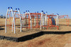 Custom colored Sunny Sands Get Physical Structure at Heritage Elementary School in Edmond, OK. White Posts, Orange Rails and Pacific Blue Plastics