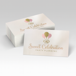 Stack of business cards with one showing the front and the light is shimmering off of it.