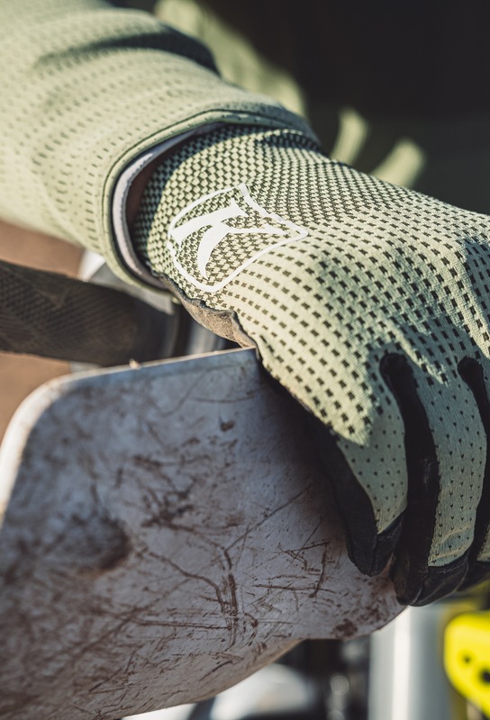 Close-up of a Klim offroad glove on a handlebar
