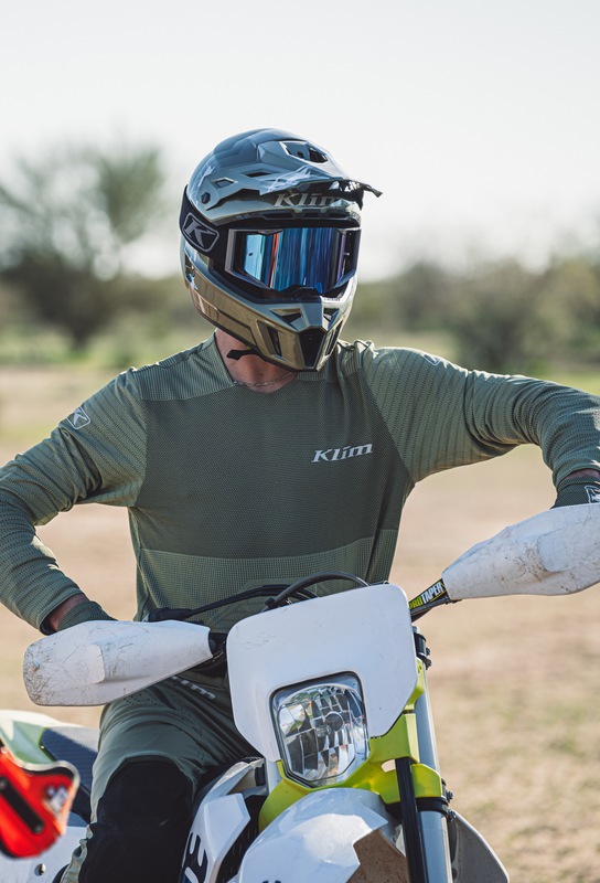 Klim offroad rider wearing a green jersey