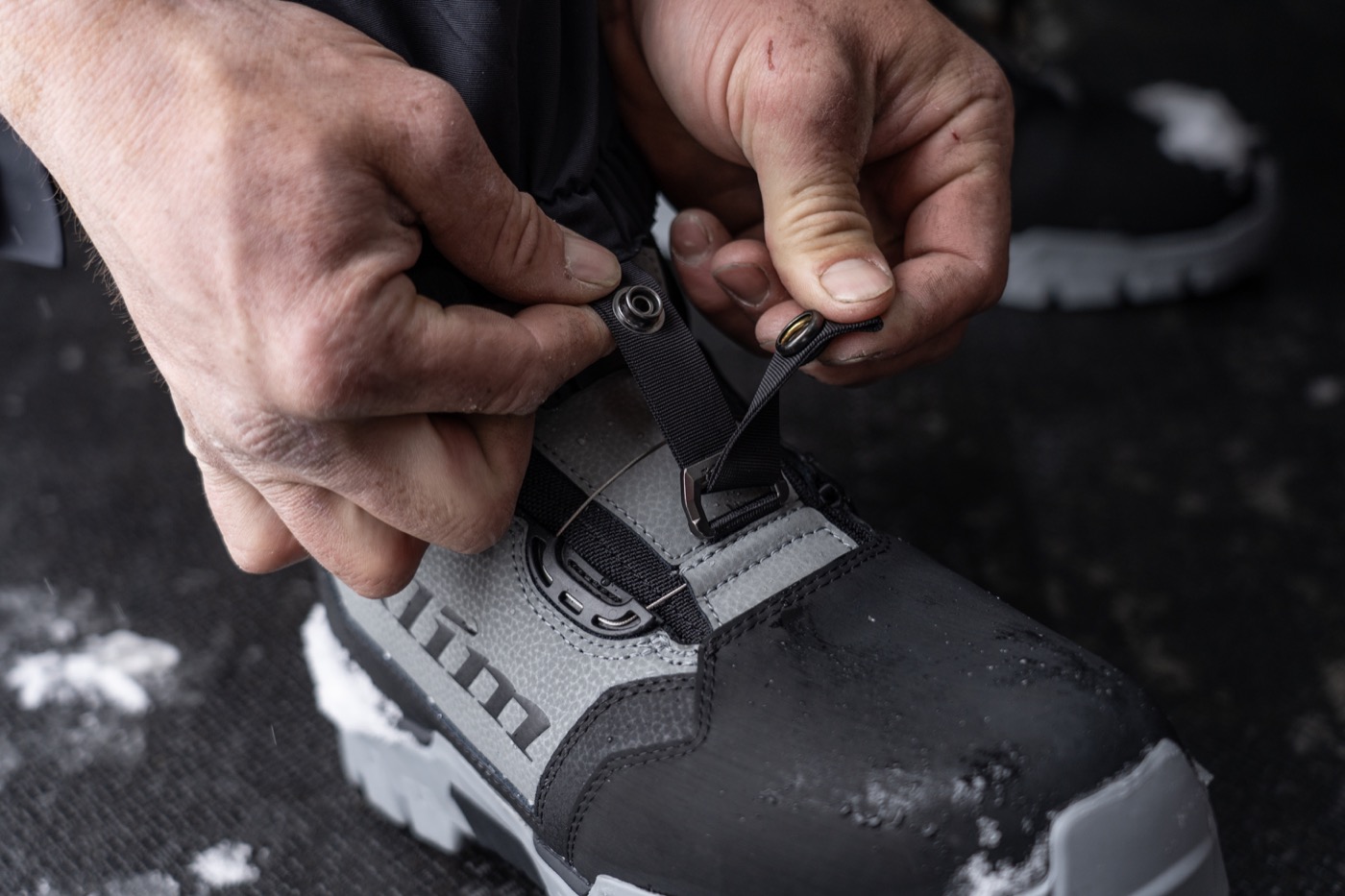Klim snow boot being fitted before a ride