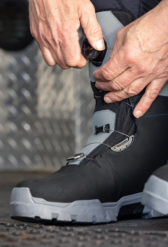Klim snowmobile boot being fitted before a ride