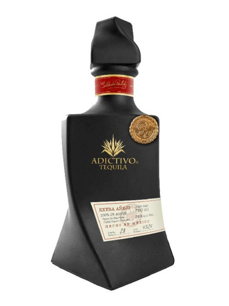 Buy Tequila Adictivo Extra Añejo is 100% pure Blue Agave, dark amber with reddish hues with excellent roasted flavor, sweet and fruity aromas.
This Extra Anejo is bottled in a Limited Edition Black Ceramic bottle online at sudsandspirits.com and have it shipped to your door nationwide.