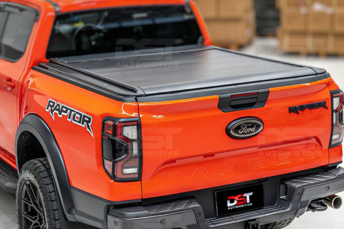 Vehicle with Turtle roof rack carrying bikes in countryside