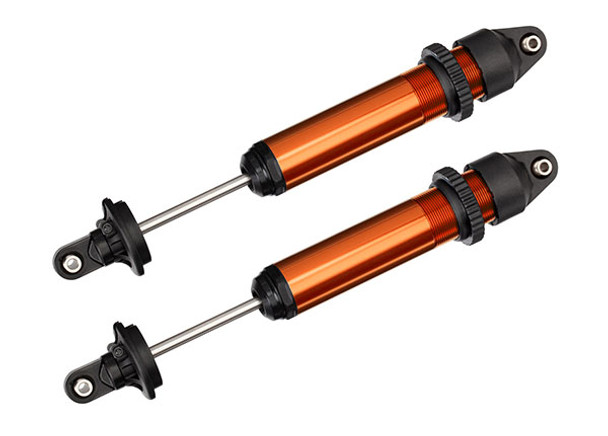 TRA7761T TRAXXAS X-Maxx Shocks, GTX, aluminum, orange-anodized (fully assembled w/o springs) (2)