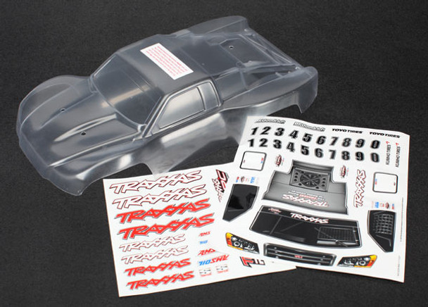 TRA7012R TRAXXAS  Body, 1/16th Slash (clear, requires painting)/grille, lights decal sheet