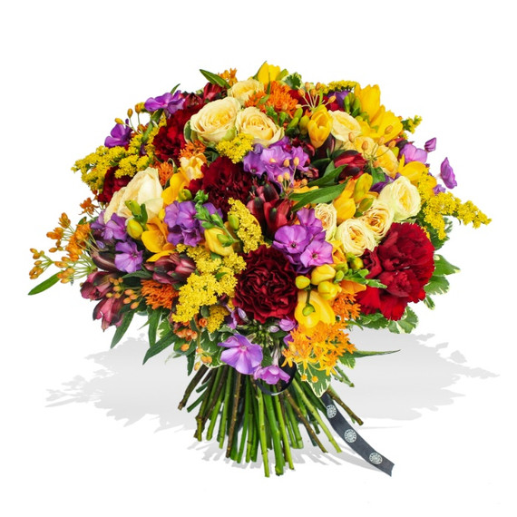 Mixed flower arrangement with yellow freesias and carnations