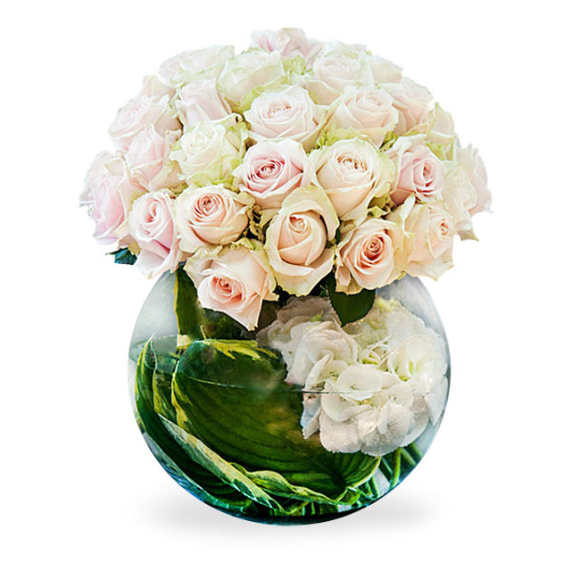 hosta leafs and hydrangea in glass fishbowl by flower station uk Christmas Flower Delivery