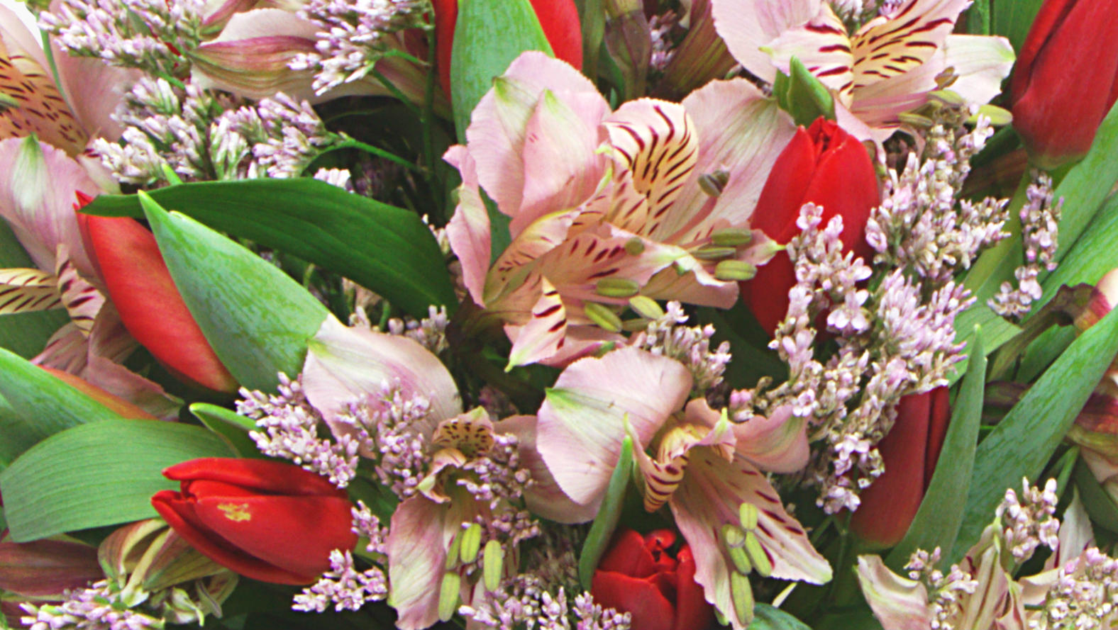 funeral spray with roses and chrysanthemums