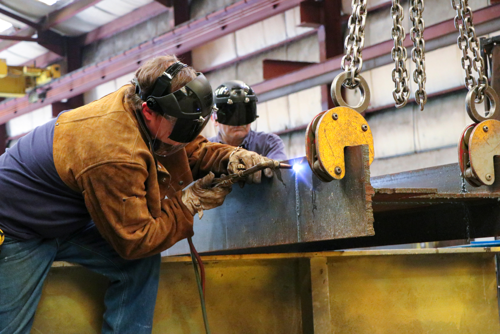Ace Industries welders building overhead cranes