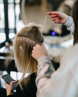 Model Installing Hair Extensions On Mannequin Head