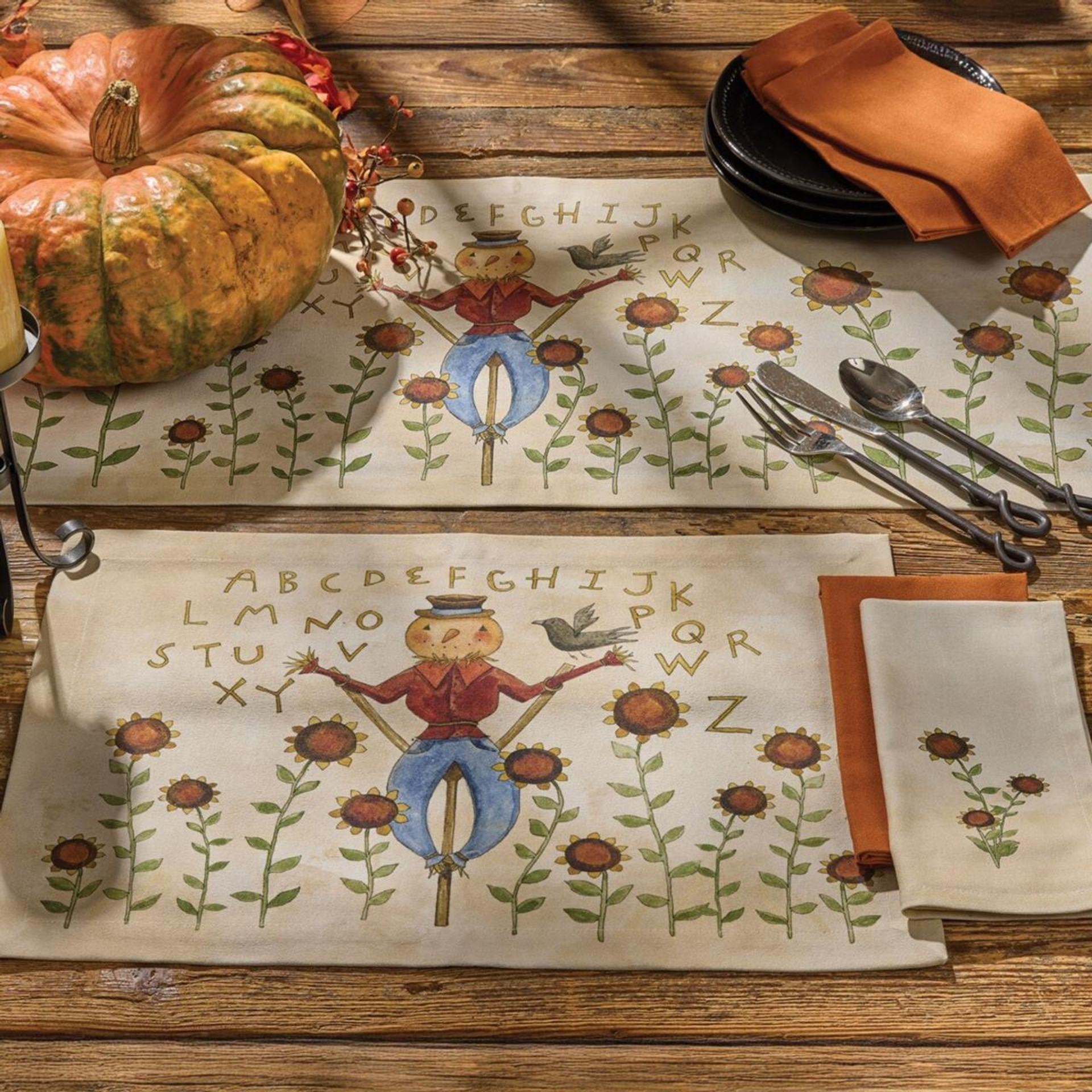 Table decorated with whimsical scarecrow table linens