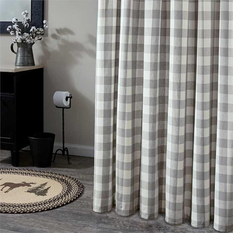 Bathroom with a dove gray check shower curtain covering the tub