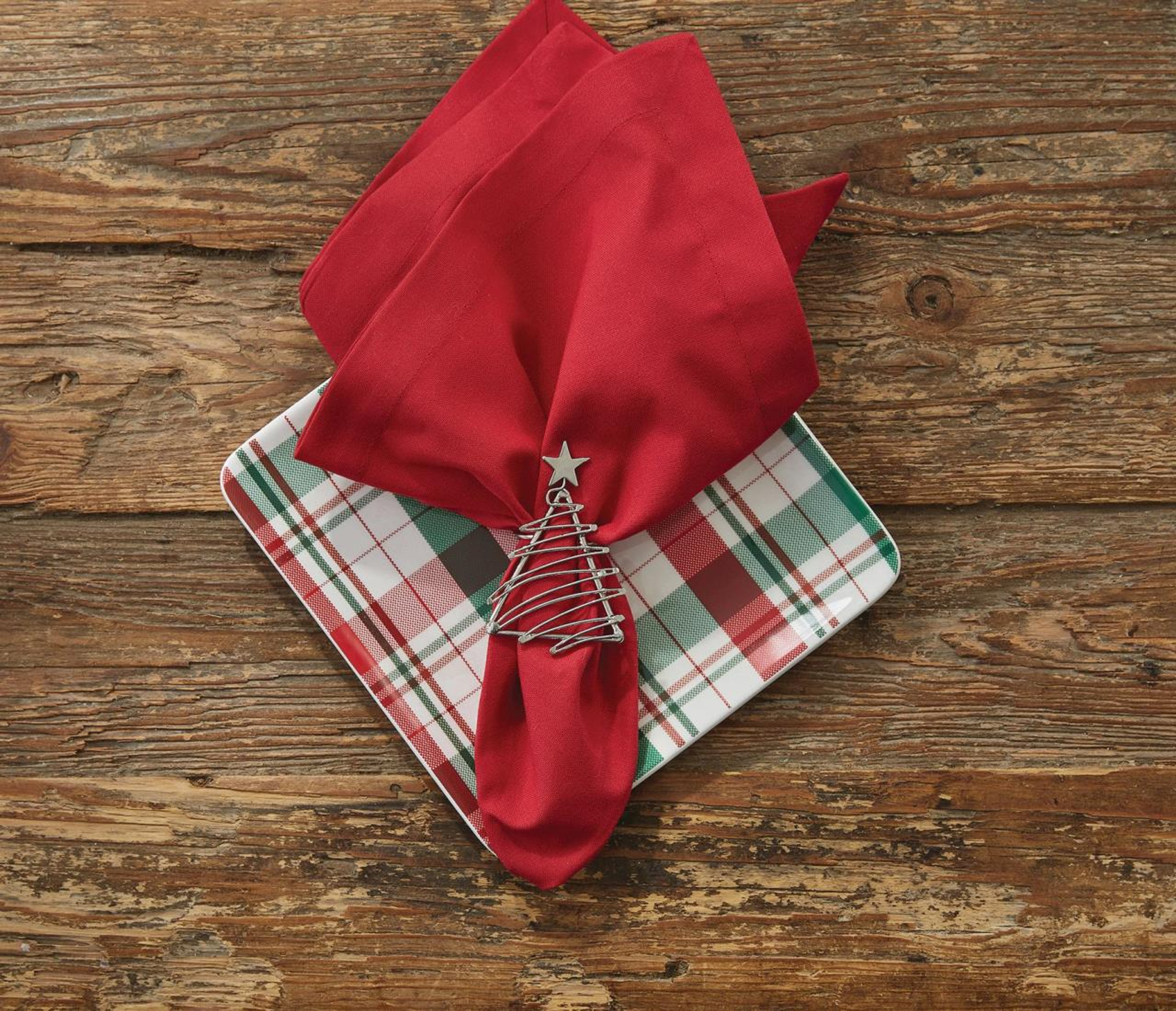 Christmas tree napkin ring over a red napkin