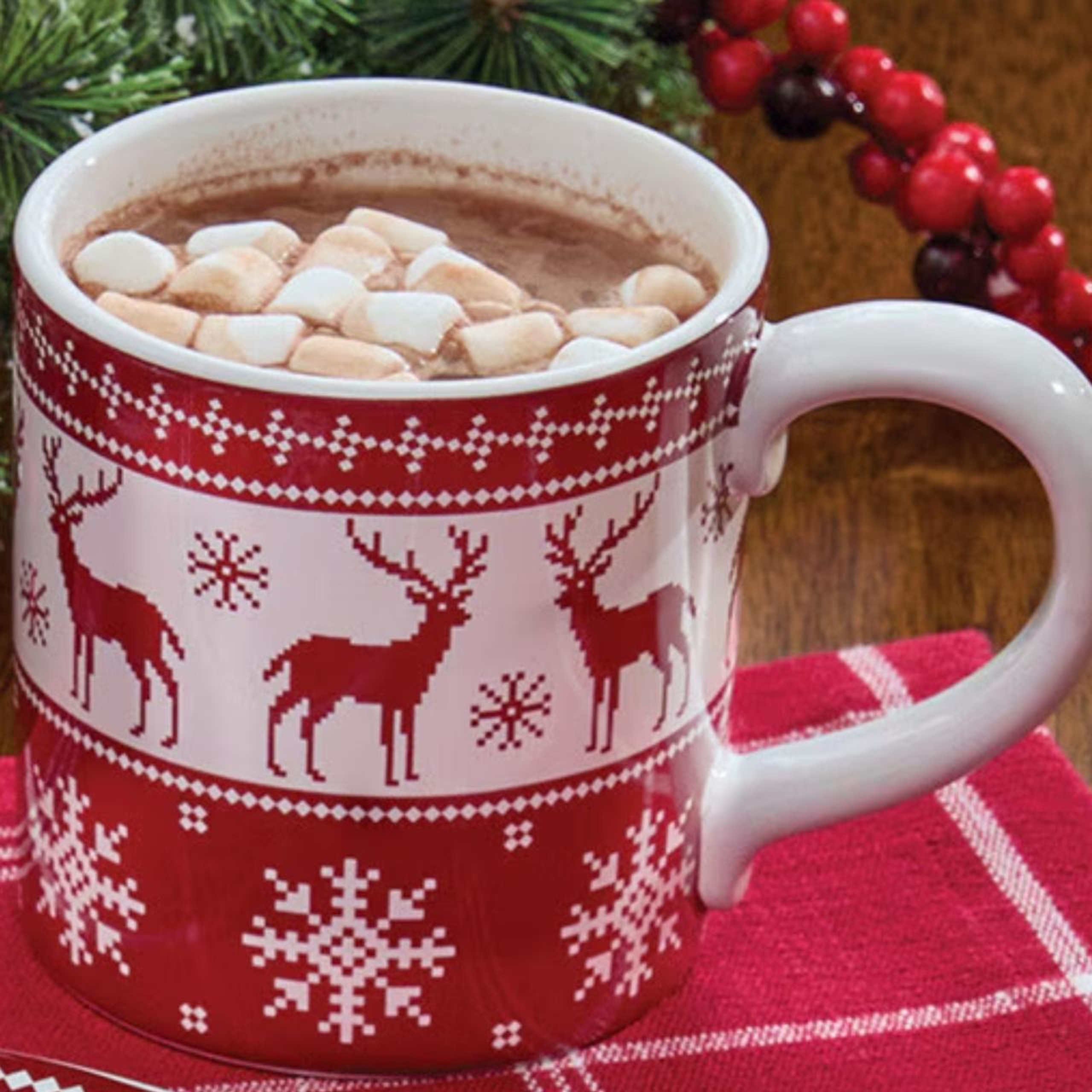 Holiday fairisle mug full of hot chocolate and marshmallows