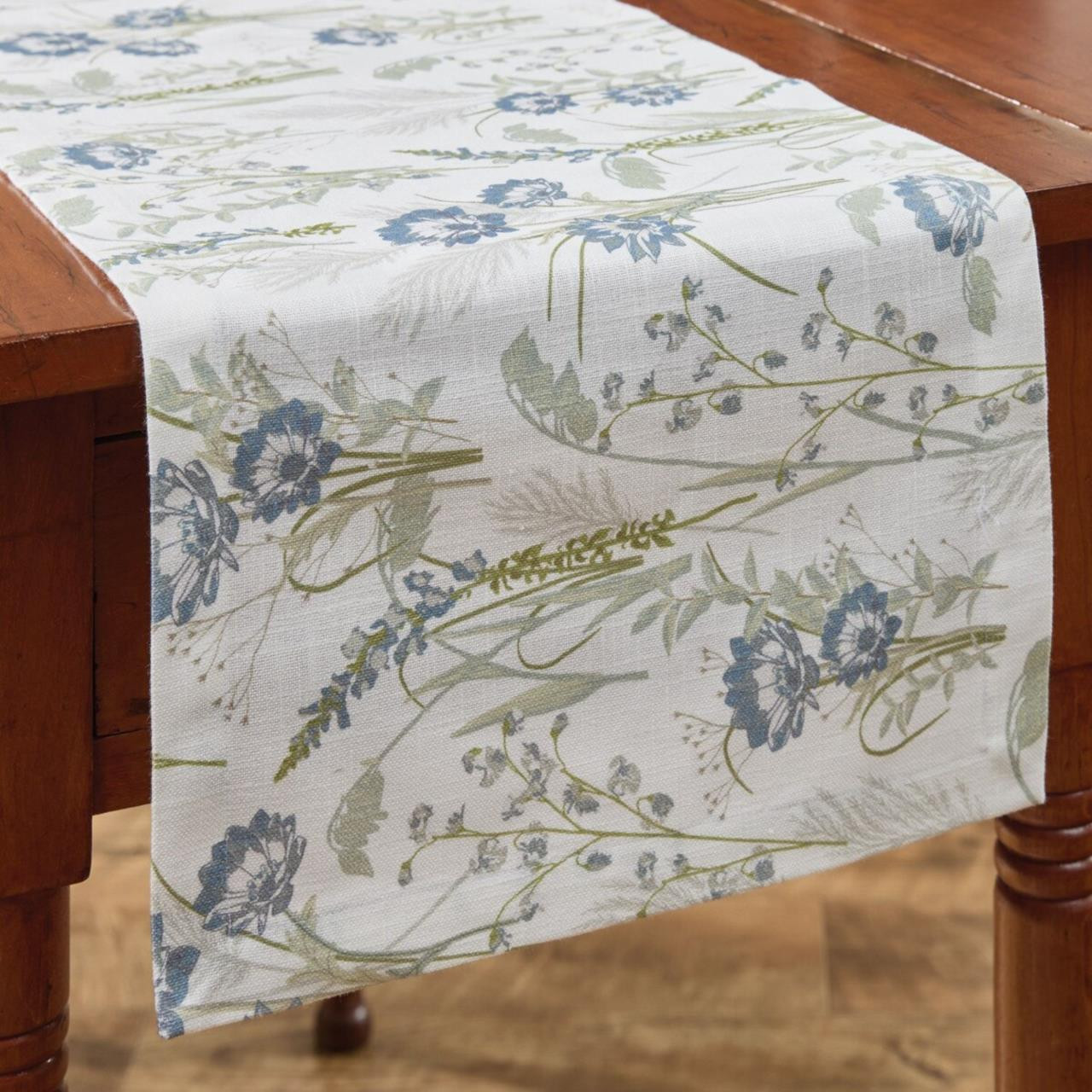 Whispering Grove table runner on a wood table