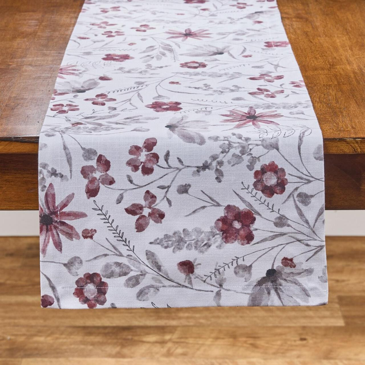 White floral table runner on wood table