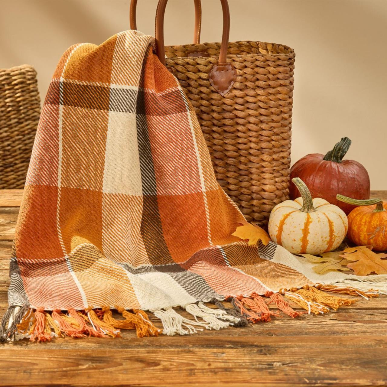Orange plaid throw draped over a basket