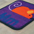 Carpeted seating square with letter m and mouse image on square