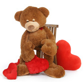 Chester Mittens is a soft cuddly light brown sleepy teddy bear holding a plush red heart – use him as a body pillow!