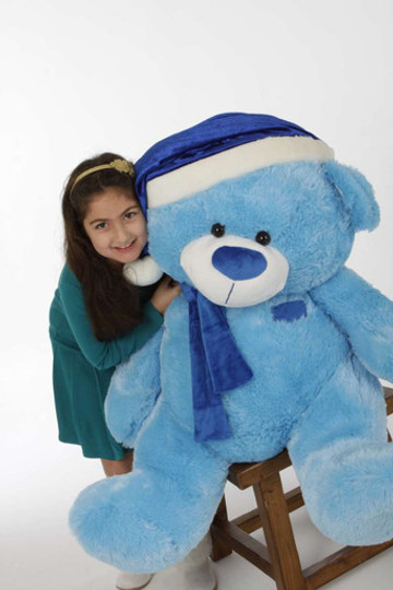 Marty Shags is 45 inches of beautiful blue Christmas Teddy Bear in a blue Santa hat and scarf