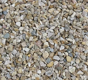 A decorative stone, in a neutral color, ideal for top dressing or accenting a landscape.