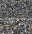 Neutral stone for landscape projects, hole backfill or portland cement.