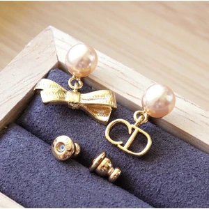 Dior CD Bow Earrings Gold-Finish Metal and Iridescent Pink Resin Pearls