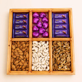 Wooden Tray Full of Dry Nuts & Chocolates