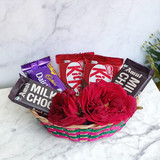 Chocolates Treat With Red Roses In A Basket