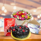New Year Bliss: Cake, Lindt Chocolates ,Greeting Card & Flowers Bouquet Gift New Year Bliss: Cake, Lindt Chocolates ,Greeting Card & Flowers Bouquet Gift