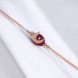 Half Moon Design Rakhi with Maroon Stone