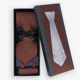 Playful Contrast: The Black Tie with Orange Dots