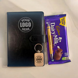 Customized Corporate Gift: Notebook, Keyring, Wooden Pen and Cadbury Chocolate Customized Corporate Gift: Notebook, Keyring, Wooden Pen and Cadbury Chocolate