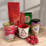 Celebrate Mom with Love: Rakura Tea, Cashews, Biscuits, Rasgulla & Mug Gift Set Celebrate Mom with Love: Rakura Tea, Cashews, Biscuits, Rasgulla & Mug Gift Set