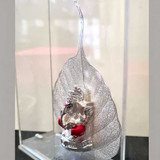 Silver Ganesh Idol Sitting on Beautiful Silver Peepal Leaf Giftmandu Silver Ganesh Idol Sitting on Beautiful Silver Peepal Leaf Giftmandu