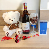 Delightful Gift Set with 750 ml Red Wine, Treats & Wind Charm