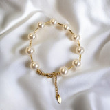 Stylish Golden Bracelet Featuring White Pearls and Adjustable Clasp