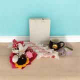 Cozy Delight Gift: Mug, Chocolates, Candle & Crochet Bouquet