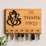 Decorative Wooden Key Holder with Ganesh Cutout and Engraved Family Name