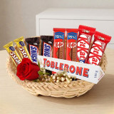 Assorted Chocolate Delight Basket With Single Rose