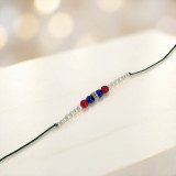 Handmade Tri-Color Bead Rakhi with Pearl Accents