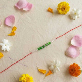 Handmade Green Bead Rakhi with Pearl Accents RK-17