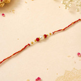 Pearl & Red Beads Rakhi with Golden Accents RK-21