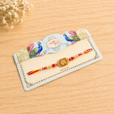 Divine Gold Om Centerpiece Rakhi with Peacock Card RT-1148